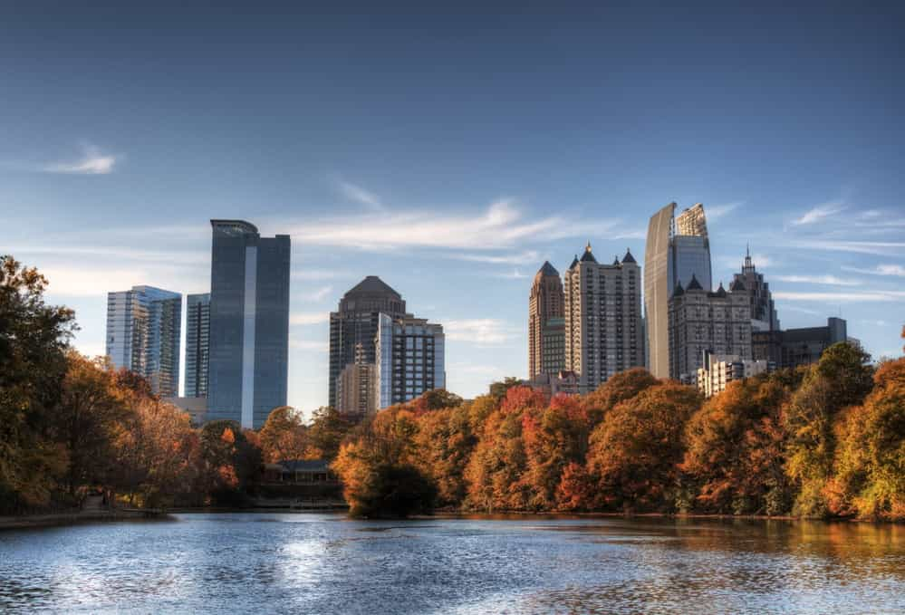 Skyline and reflections of midtown Atlanta, Georgia in Lake Meer from Piedmont Park.-1